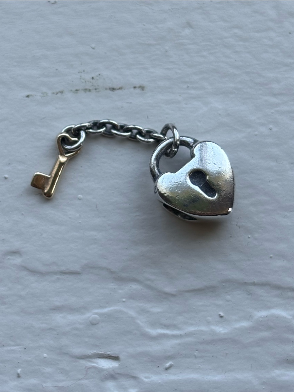 Retired silver and gold Pandora charm heart and key